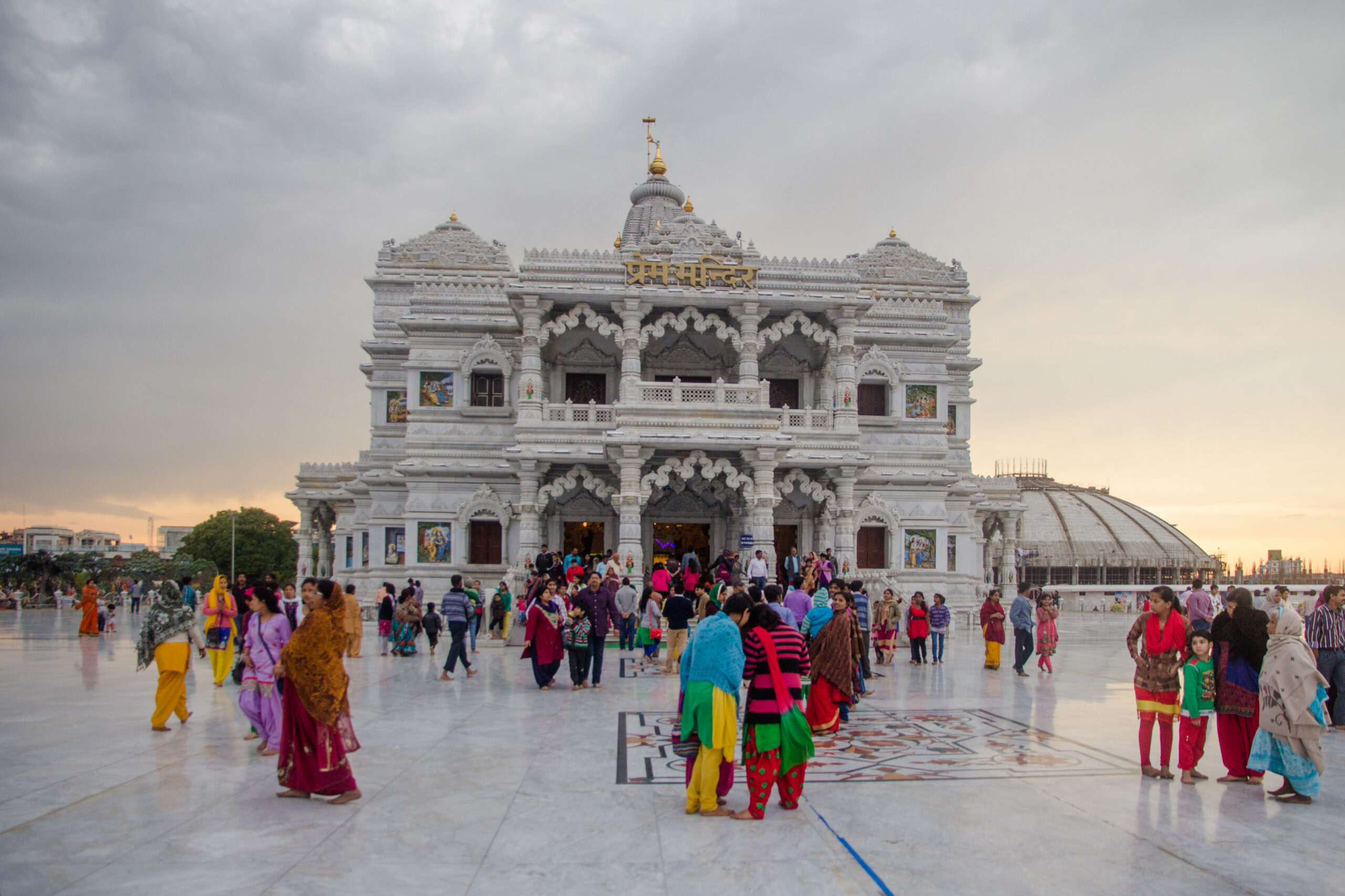 Prem Mandir, Vrindavan, temple exterior, white marble, devotees, evening, spiritual architecture, religious site, Hindu temple, cultural heritage