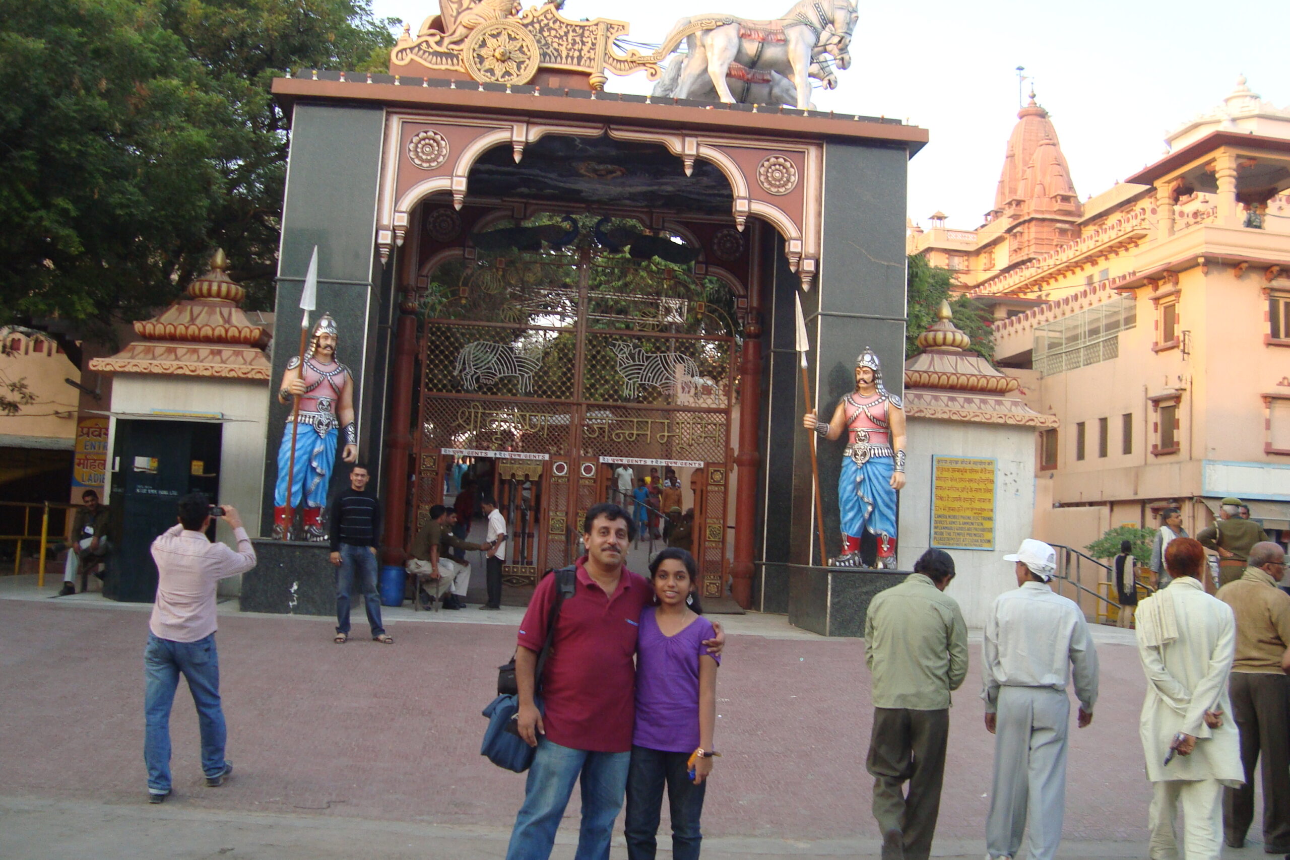 Mathura, Krishna Janma Bhoomi, temple entrance, Hindu temple, pilgrims, temple guardians, religious site, architectural detail, cultural heritage, tourist attraction