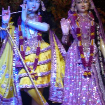 Prem Mandir, Vrindavan, deity statues, Lord Krishna, Radha, temple worship, Hinduism, religious art, intricate costumes, spiritual atmosphere