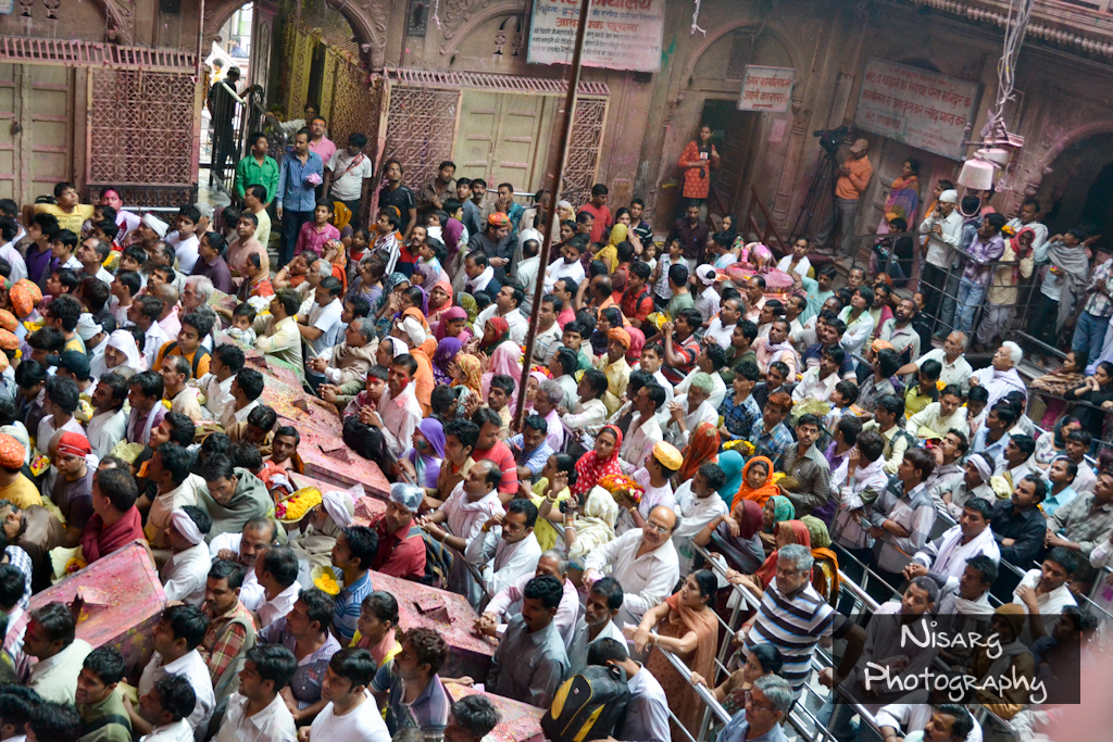 Holi festival, Shri Banke Bihari Temple, Vrindavan, crowded temple, Hindu festival, colorful celebration, devotees, temple interior, traditional festival, cultural event