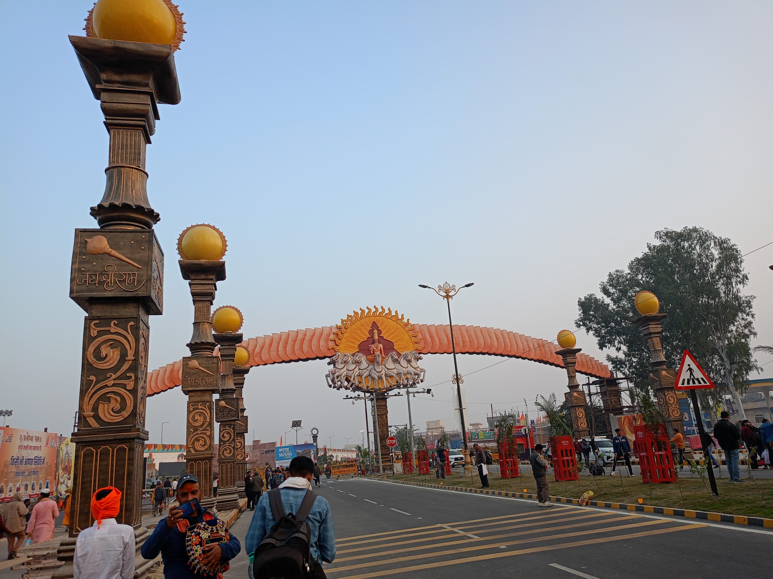 Ayodhya, main gate, Hindu architecture, Surya, traditional design, cultural landmark, entrance, street scene, pilgrimage site, religious tourism