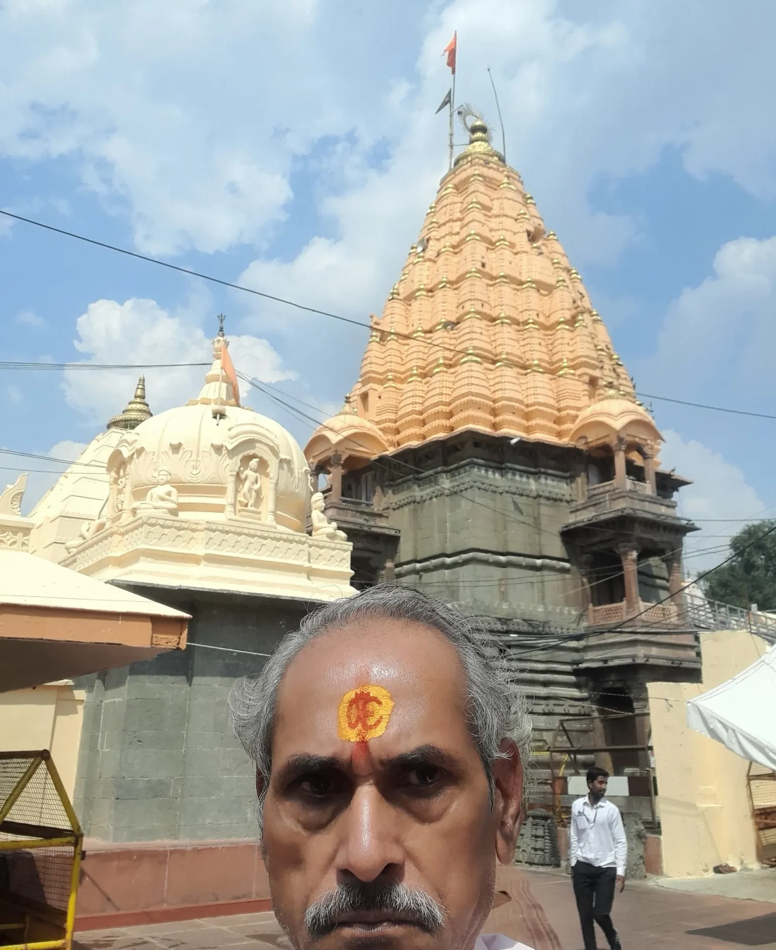 Mahakaleshwar Temple, Ujjain, Hindu temple, religious site, temple spire, Indian architecture, pilgrimage, spiritual journey, devotee, traditional tilak